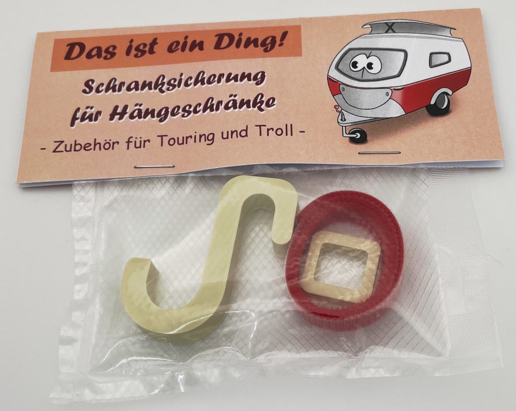 Produktfoto von unserer Schranksicherung für Hängeschränke im verpackten Zustand.